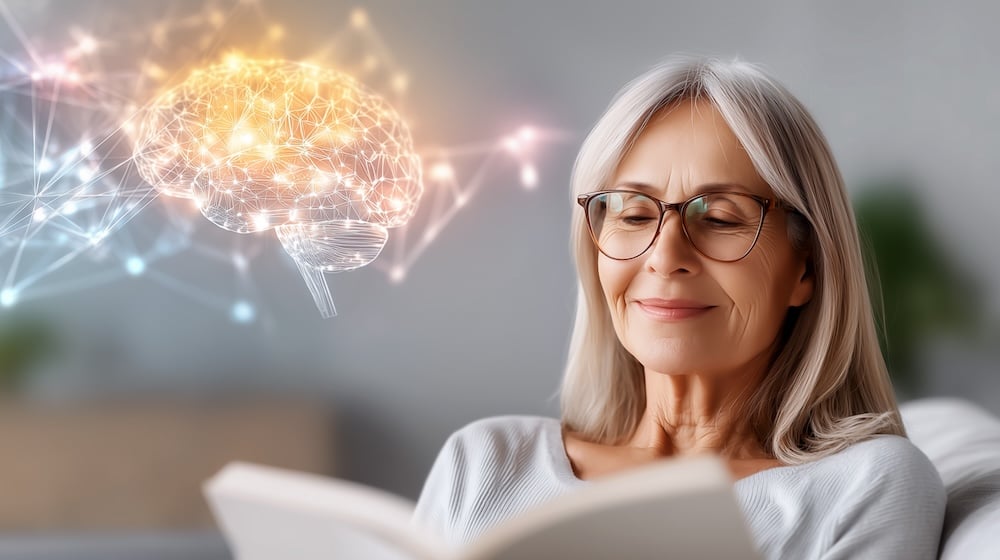 Woman reading with digital brain neural network hologram